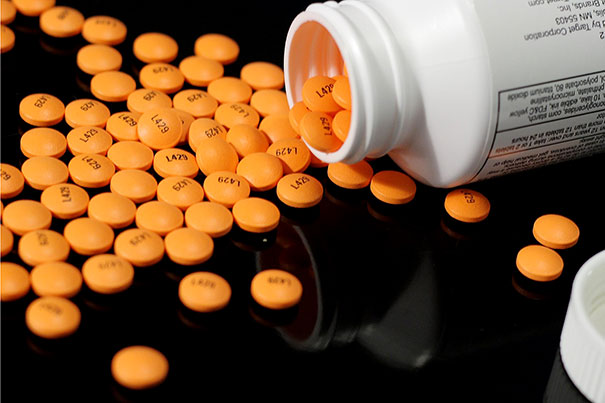 Generic regular strength enteric coated 325mg aspirin tablets, distributed by Target Corporation. The orange tablets are imprinted in black with "L429". From Wikimedia Commons, the free media repository