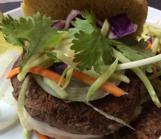 Spicy, black bean burger with cilantro and a light, yogurt sauce