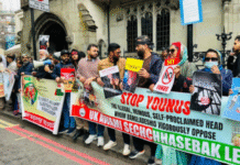 Protests Greet Bangladesh’s Interim Leader Yunus as He Begins UK Visit